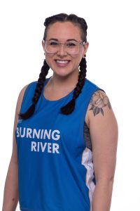 MC Slammer, wearing a Burning River jersey, smiles